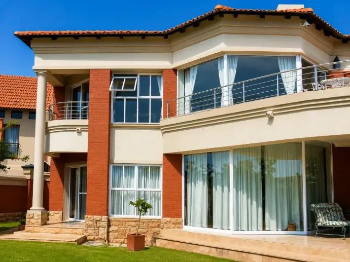 Face brick and plaster home with first floor balcony in Pretoria